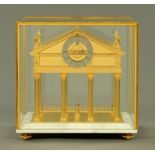 A brass Palladian Congreve rolling ball timepiece, 20th century, by Rodney Jackson of Chronos,