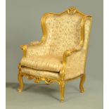 A French style wing armchair,