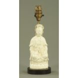 A Chinese Blanc de Chine figure, with table lamp mount. Height including light fitting 28.5 cm.