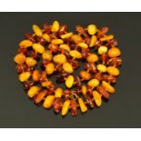 A necklace of amber beads, natural and butterscotch in colour, 59.4 grams.