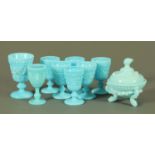 A set of six Victorian pressed blue glass goblets, with relief moulded scrolling decoration,