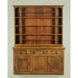 An antique oak dresser with Delft rack,