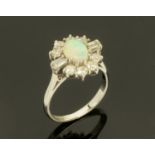 An 18 ct white gold opal and diamond ring,