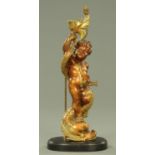 A 19th century Italian giltwood and gesso standing cherub, raised on a wooden base,