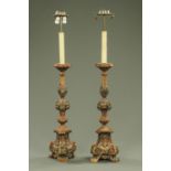 A pair of wood and gesso painted lamp standards, in the Italian style.