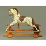 A carved and painted "Haddon Rockers" rocking horse, with dapple grey body,
