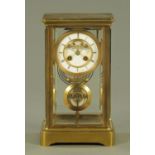 A 19th century gilt brass four glass mantle clock, with brocot escapement,
