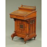 A late 19th century walnut Davenport, with rear stationery compartment,