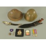 Two Asian World War Two period steel helmets, British Victory and Defence Medals,