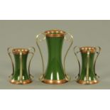 Three Art Nouveau pottery vases in silver plated and copper mounts,