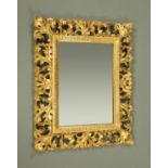 A late Victorian/Edwardian Florentine gilt framed mirror. Height 54 cm, width 44 cm.