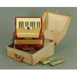 A vintage Hohner accordion, with three treble and twelve bass buttons, in original case,