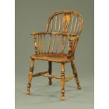 A 19th century ash and elm Windsor armchair, with pierced splat back above a well figured elm seat,