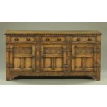 A Siesta style carved oak dresser base,