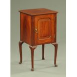 A mahogany bedside cabinet, with single door and raised on cabriole legs terminating in pad feet.