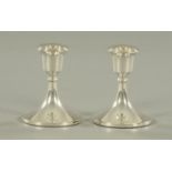 A pair of silver chamber candlesticks, with weighted bases, maker Sydney & Co., Birmingham 1924.