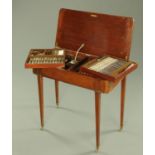 A mahogany canteen of cutlery, modelled as a side table,