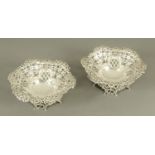 A pair of silver bonbon dishes, raised on pierced feet, stamped "Goldsmiths Silversmiths Co.