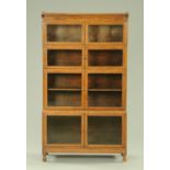 An early 20th century oak stacking sectional bookcase, with glazed doors. 89 cm wide, 157 cm high.
