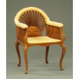 A Sheraton Revival mahogany armchair, with slat supports,