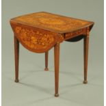 An early 19th century Dutch marquetry Pembroke table, with elliptical drop leaves,