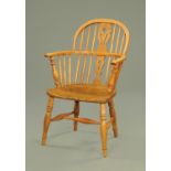 A 19th century light elm and ash comb back Windsor chair,