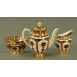 A Royal Crown Derby Imari pattern coffee pot, sugar bowl and milk jug, date code for 1933,