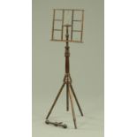A Wheeldon Patent turned and stained beech adjustable music stand, with duet attachment.