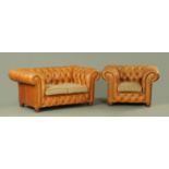 A modern tan leather Victorian style Chesterfield two seater settee, with matching armchair,