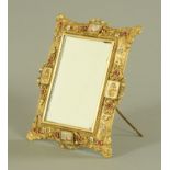 A pressed gilt brass dressing table mirror,