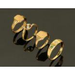 An 18 ct gold ring set with a diamond and emerald (a further stone missing),