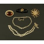 A seed pearl star shaped brooch, a polished hardstone brooch, paste set bracelet,