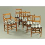 A 19th century Harlequin set of six oak chairs, comprising carver armchair and five singles,