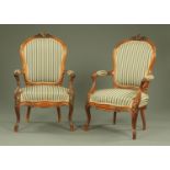 A pair of late Victorian rosewood armchairs, with exposed moulded showframes,