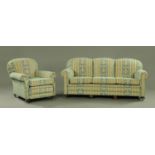 A late 19th century/early 20th century three seater settee with matching armchair,