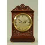 A good late Victorian carved mahogany double fusee bracket clock,