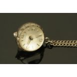 A silver pendant ball watch by Huguenin, on silver chain.