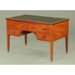 A late George III mahogany desk with fitted drawers,