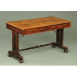 An early Victorian rosewood library table, with chamfered edge above two frieze drawers,