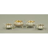 Two pairs of silver salts, marks rubbed, together with two pairs of silver salt spoons,