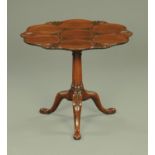 A George III mahogany supper table, with seven dish shaped top and moulded edge,