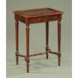 A mahogany bijouterie cabinet, with carved edge,