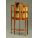 A George V mahogany and boxwood strung breakfront display cabinet,