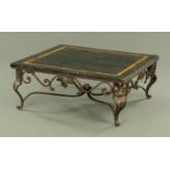 A wrought iron based square form coffee table, with stone and marble top.