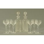 A pair of 19th century cylindrical glass decanters,