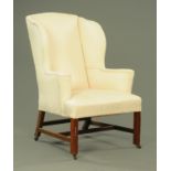 A George III style mahogany easy chair, wing back,