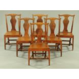 A set of six George III country oak Chippendale style splat back dining chairs,