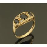 A ladies 9 ct gold dress ring set with blue and clear stones, ring size L/M.