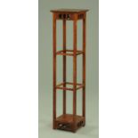 An Arts and Crafts stained wooden plant stand, with square top and low shelf, width 30.