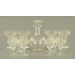 A part suite of drinking glasses, comprising decanter, four red and six white wine glasses,